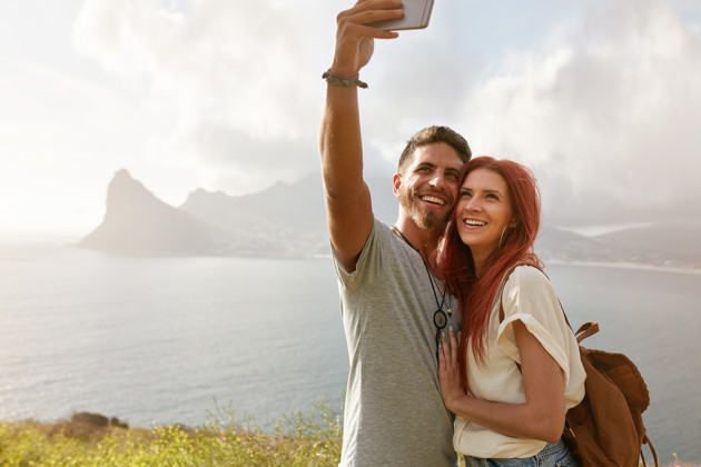 Cheerful Young Couple On Holidays Taking Selfie